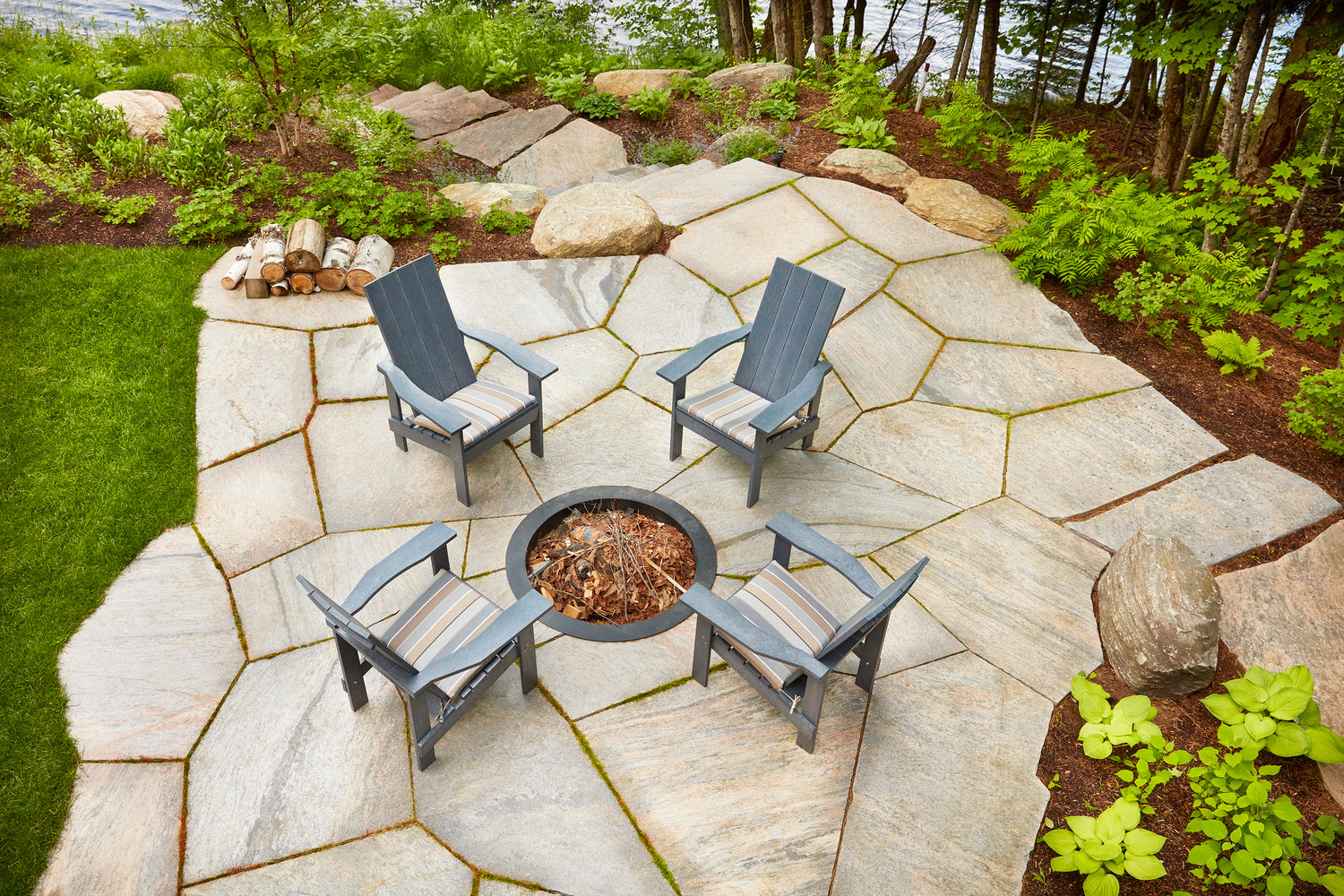 slate grey Modern Adirondack chairs on stone patio with bonfire