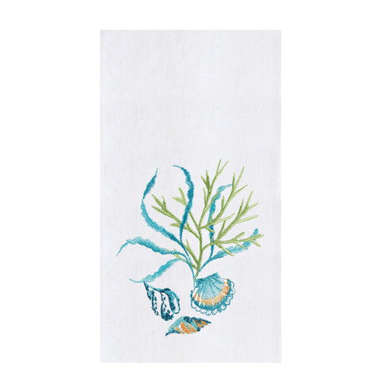 White towel with blue and green shells and seaweed.