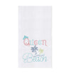 White towel with blue and pink text reading "Queen Beach" next to palm trees.