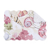 Placemat with blush, brown, and blue seashells and vegetation.