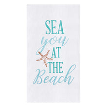  White towel with green-blue text next to a starfish.