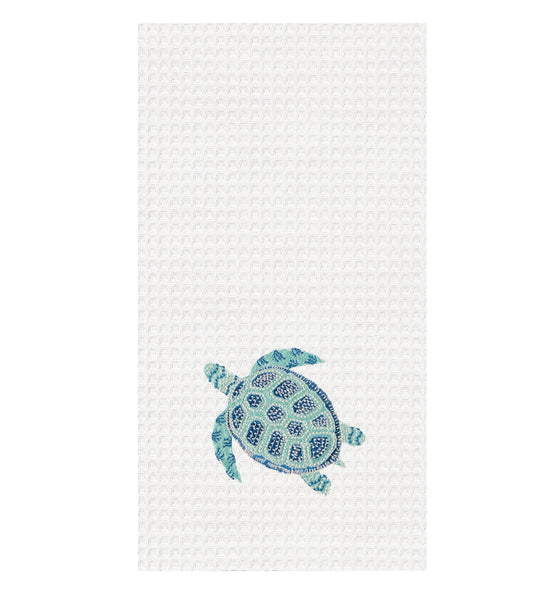 White towel with aqua and dark blue turtle.