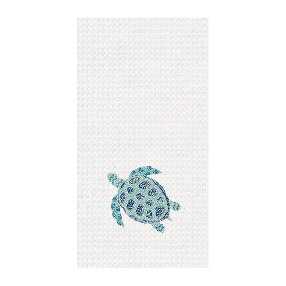 White towel with aqua and dark blue turtle.