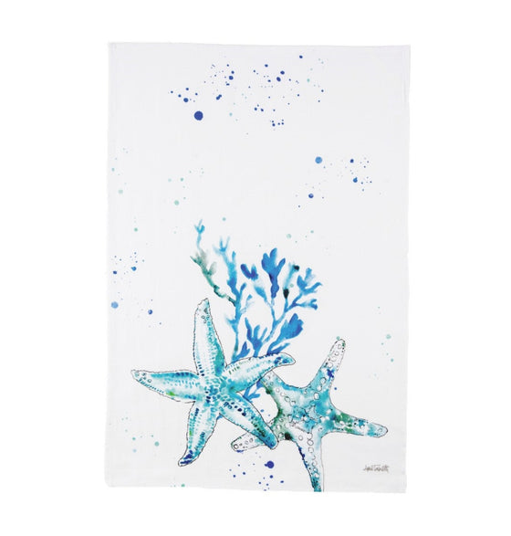 White towel with blue starfish, coral, and paint splatters.