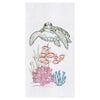 White towel with green turtle swimming above pink, blue, and green, coral reef.