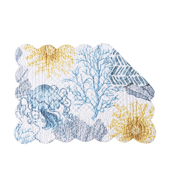 White placemat with blue and yellow sealife and vegetation.
