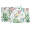 Table runner with beige, blue, green, and yellow sealife, shells, and vegetation.