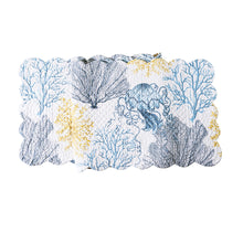  White table runner with blue and yellow sealife and vegetation.