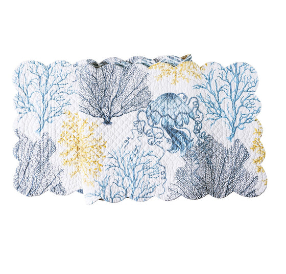 White table runner with blue and yellow sealife and vegetation.
