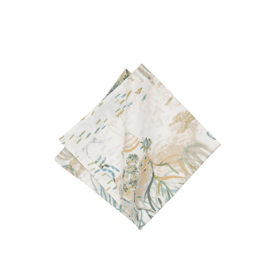 Beige, green, and blue cloth napkin with sealife, coral, and other marine motifs