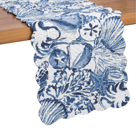 Blue Coast Shells Table Runner hanging off of the side of a table