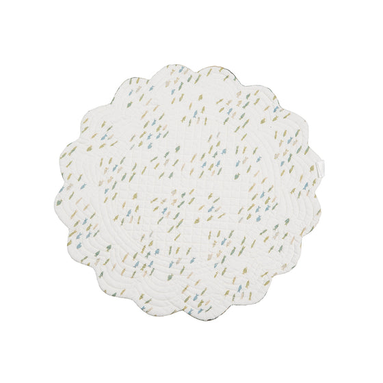 Round placemat with green, blue, and beige schools of fish on a white background
