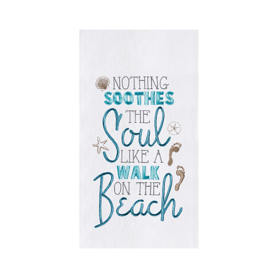 White towel with blue and brown phrase "nothing soothes the soul like a walk on the beach."