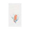 White towel with orange seahorse on top of blue and green coral.