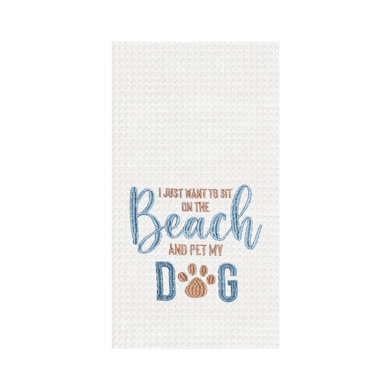 White towel with blue and brown text reading "I just want to sit on the beach and pet my dog."