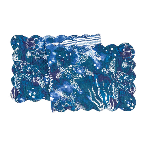 Blue table runner with white sea turtles and vegetation.