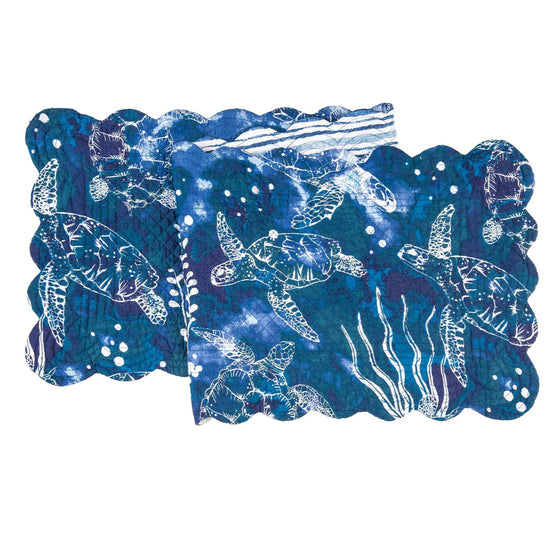 Blue table runner with white sea turtles and vegetation.