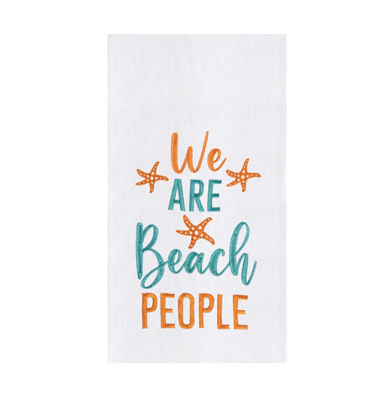 A white towel with orange starfish and orange and green text saying "We Are Beach People."